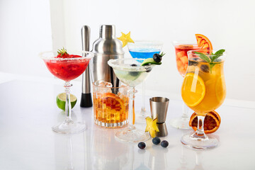 Summer cocktails in classic glasses on a white background. Party time