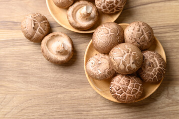 Fresh shiitake mushroom, edible mushroom and food ingredient in Asian cuisine, Table top view © nungning20