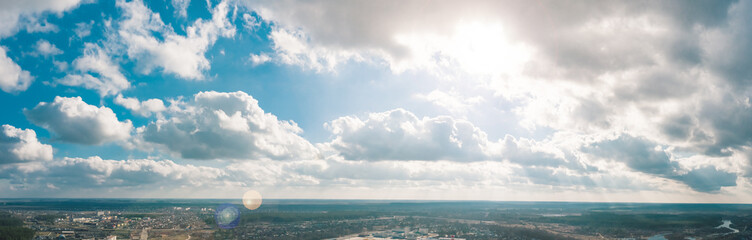 A stunning sky landscape with bright sunlight and fluffy clouds creating a captivating view