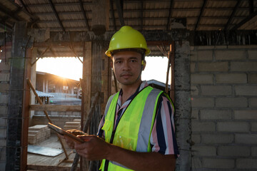 Engineer man working with tablet computer on construction site