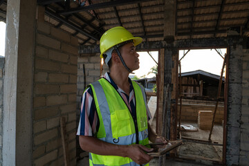 Engineer man working with tablet computer on construction site