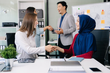 Two confident business man shaking hands during a meeting in the office, success, dealing, greeting and partner]