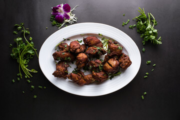 grilled Crab with Chilli Sauce served in dish isolated on dark background top view of thai food