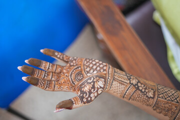 Mumbai, India 23rd July 2024: Close-up shots of an Indian bride getting henna also known as Mehendi...