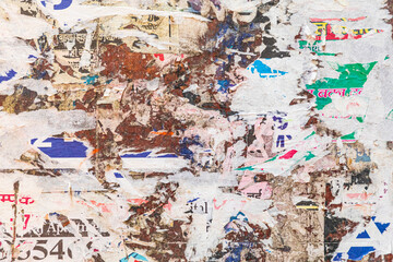 Naklejka premium Abstract of layers of torn handbills on a wall.