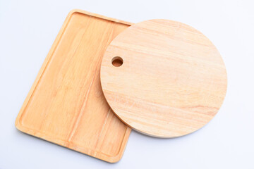 brown wooden tray and sphere cuttingboard isolated on white background