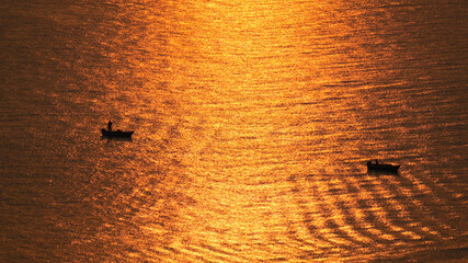 beautiful golden ocean view with boat in the morning