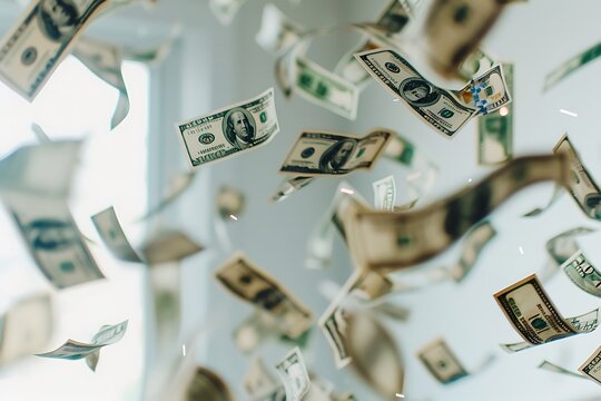 hundred dollar banknotes fall on graund