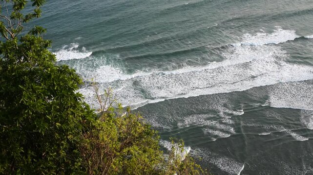 High-angle long view of the wave in the Indian Ocean at Parangtritis Beach.