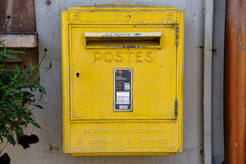 Eguisheim,France - June 18，2024：Yellow post box in France