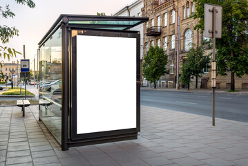 Mock Up Of Vertical Blank White Billboard At A Bus Stop On A City Street. Empty Outdoor Advertising Poster To Display Branding Campaign