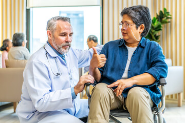 Obraz premium Orthopedist examines the knee of elderly patient to collect information for physical therapy treated. Doctor touch knee pain area of Old woman legs talking about knee pain symptom.