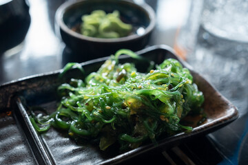 Wonderful view of a bowl of Wakame seaweed salad, typical dish in East Asia.