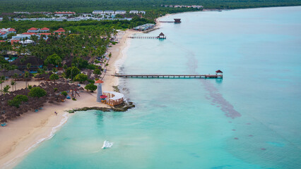 Obraz premium Dominican Republic Bayahibe beach, Lighthouse aerial photo by drone. Crystal clear sea with beautiful sandy beach.