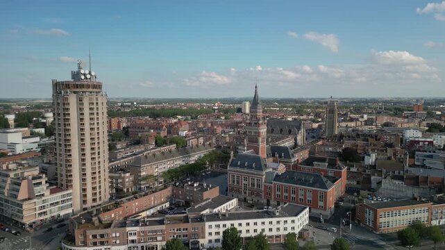 The drone aerial footage of Marina Port du Commerce and the tower of the townhall, Dunkirk, France. Dunkirk is a commune in the department of Nord in northern France.