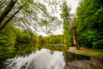 Fototapeta premium Hexenteich near Menden. Idyllic small pond with green nature in the Sauerland. 