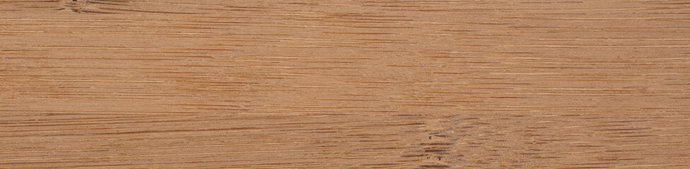 A close up view of a dark bamboo wooden surface