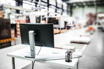 Computer in modern industrial factory, with open software.