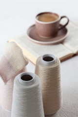 Cotton yarn. Yarn of warm tones for needlework. Knitting is like a hobby. The scheme for knitting. Light background.