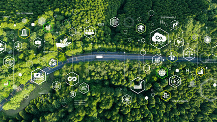 Aerial view of car in green forest with icons representing eco-friendly transport. Clean and greenhouse-free green transport concept in electric drive mode.