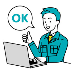 OKサインをするノートパソコンで仕事をしている作業員の男性
