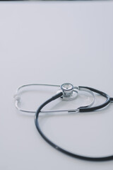 Health care billing statement with stethoscope, bottle of medicine for doctor's work in medical center stone background.