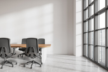 Stylish office room interior with meeting table and chairs, panoramic window