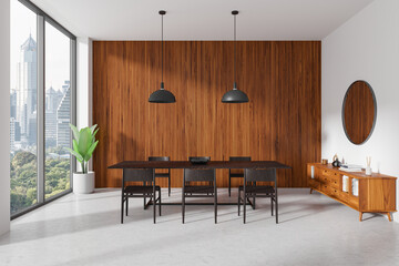 Wooden living room interior with table and chairs, drawer and window