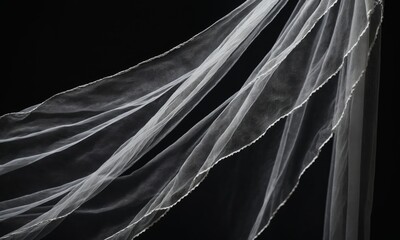 White tulle fabric on a black background