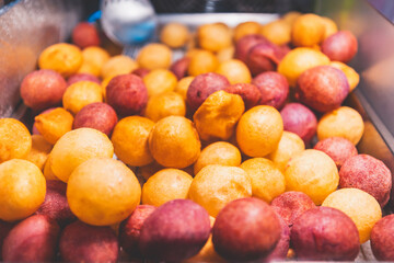 Potato fire ball dessert in street food night market Taiwan