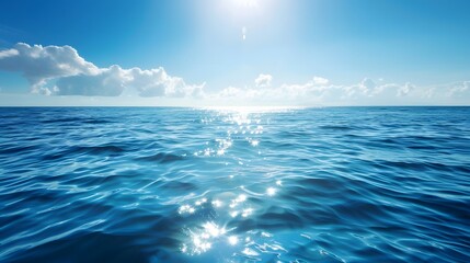 Fototapeta premium Blue sea water with sun reflection on the calm ocean surface.