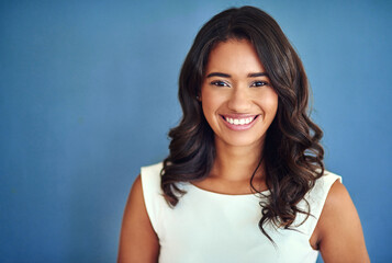 Positive, portrait or business woman in studio for profession, job or corporate worker with smile....