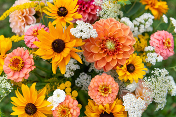 Summer bouquet. Beautiful orange, yellow and white fresh flower arrangement. Birthday or weddding bouquet made of summer flowers close up.
