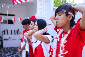 Young Asians Marbles Race Participants Ready to Line Up at the Starting Line. Commemorate Indonesian Independence Day, August 17.
