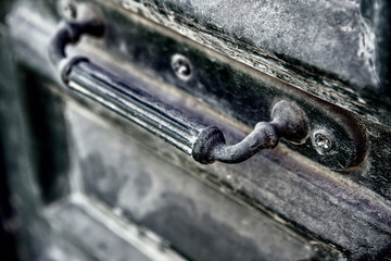 Ancient  door handle on  old wooden door