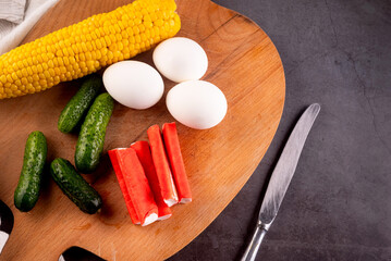 crab sticks salad ingredients: surimi, eggs, corn, cucumber and sause © vimart