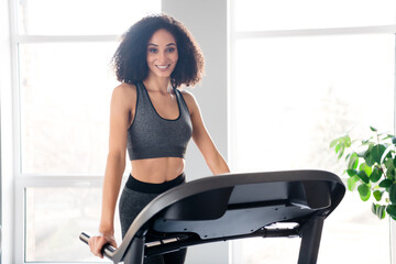 Fototapeta premium Photo of lovely pretty active girl trainer doing physical exercises in gym daylight interior indoors