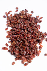 Red dried barberry on white background