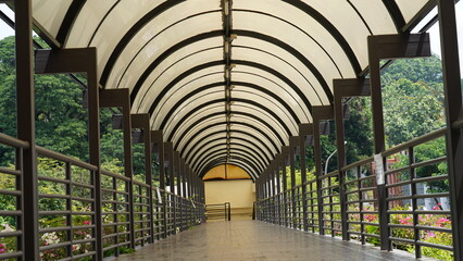 A covered walkway is a sheltered path or passage designed to provide protection from weather elements such as rain, sun, and wind. These structures are common in urban areas, parks, and campuses 