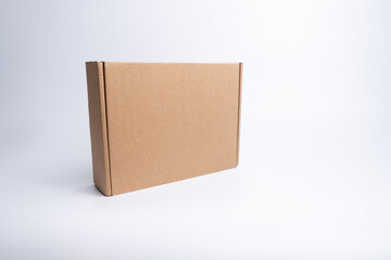 Brown paper box. Cardboard box isolated on white background. Place for text. Gift box