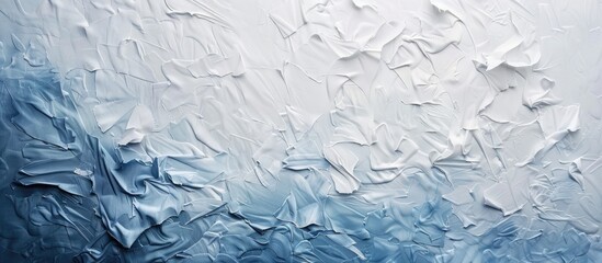 Art paper in white and blue with a varied texture forms the background for the copy space image