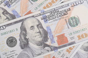 Background of US dollar bills. Top view. American vintage money cash, hundred dollar bills. Texture US dollars