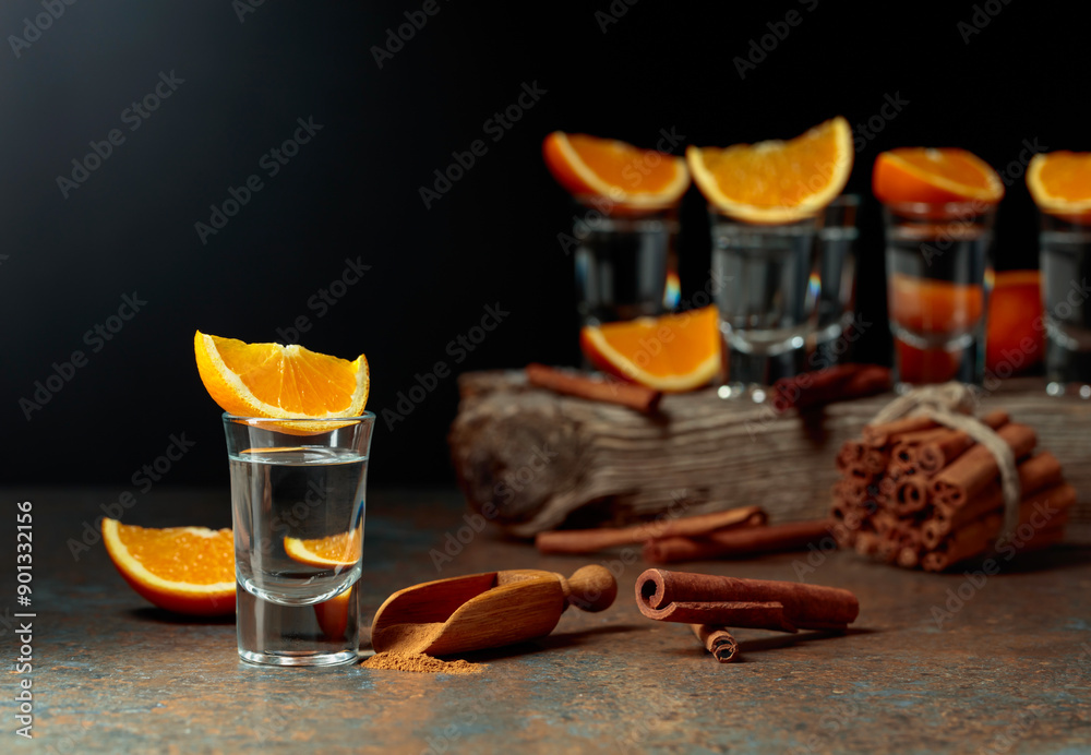 Wall mural tequila shots with orange and cinnamon.