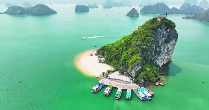 Aerial view of Ha Long bay during daytime beautiful emerald green water. This is the UNESCO World Heritage Site, a beautiful natural wonder in northern Vietnam, Southeast Asia nature background.