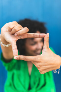 Woman making finger frame with hands