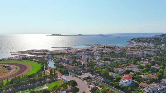 Marseille, France: Aerial view of famous French city by Mediterranean Sea, famous beaches Plages du Prado, summer day with clear blue sky - landscape panorama of Europe from above
