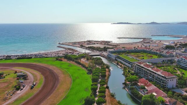 Marseille, France: Aerial view of famous French city by Mediterranean Sea, famous beaches Plages du Prado, summer day with clear blue sky - landscape panorama of Europe from above

