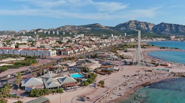 Marseille, France: Aerial view of famous French city by Mediterranean Sea, famous beaches Plages du Prado, summer day with clear blue sky - landscape panorama of Europe from above
