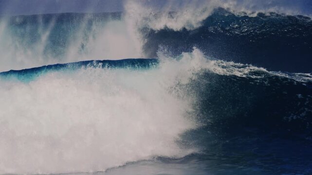 Stunning set waves crash and explode with whitewash and mist rising off top in slow motion, Cloudbreak Fiji
