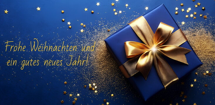 Frohe Weihnachten und ein gutes neues Jahr! Grußkarte, Weihnachtskarte. Christmas greeting card German, xmas gift box top view on blue background .Copy space. Banner. Deja Vu Blue pantone color 2025